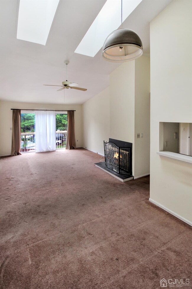 Dining and Living Room combo with 2 Skylights and 