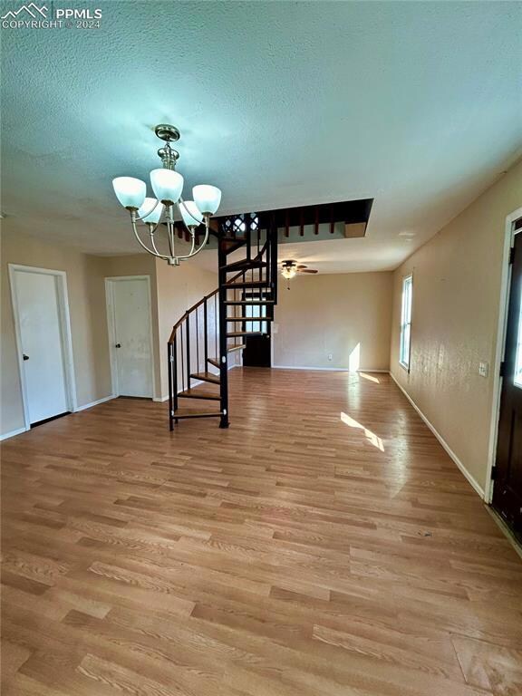 Spare room featuring light hardwood / wood-style f