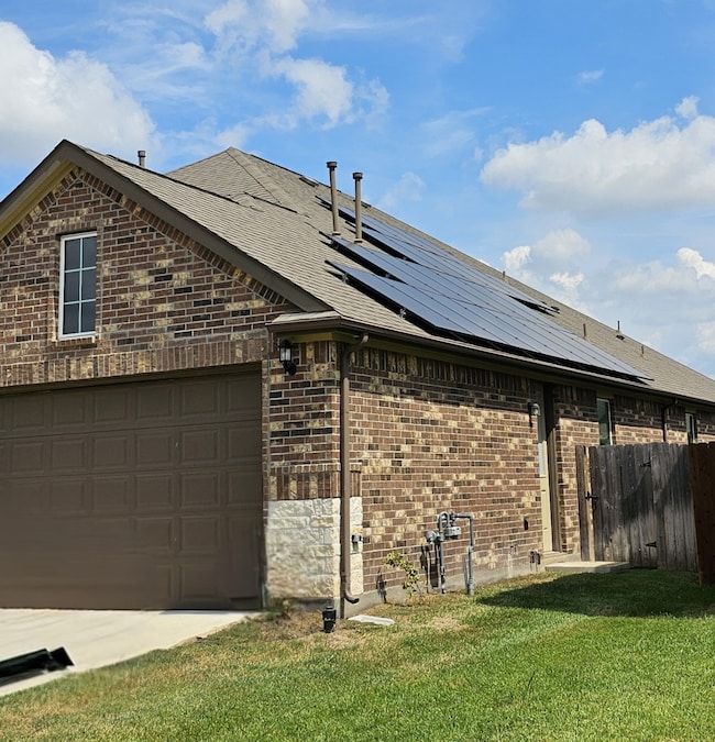 4 sided Acme Brick and Stone.  Solar panels.