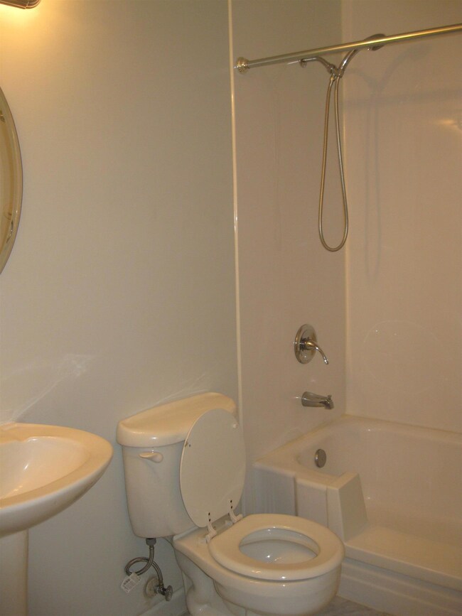 Full bathroom in the hallway with specially installed handicapped bathtub.