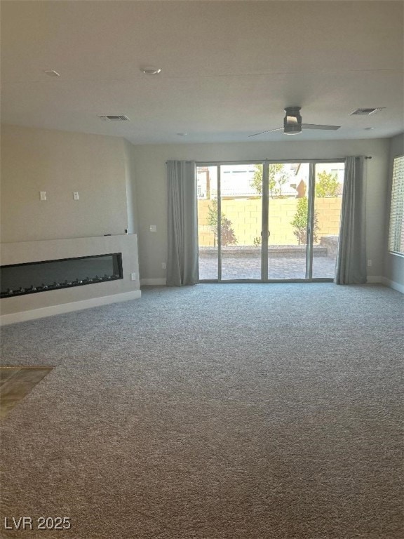Unfurnished living room featuring carpet flooring,