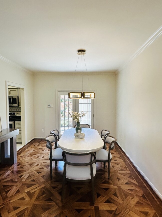 Sophisticated dining area with custom hardwood flo