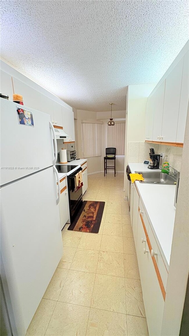 12900 SW 13th St unit E413, Pembroke Pines, FL 33027 - photo 5