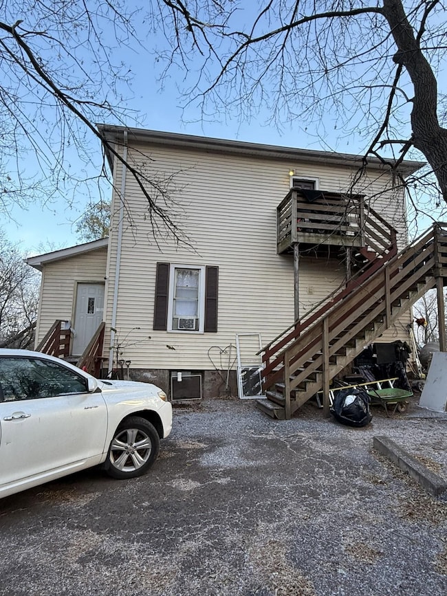 View of property exterior with stairs