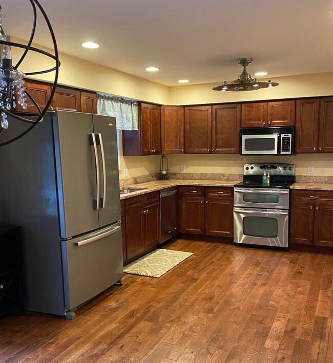Kitchen area with all appliances shown remaining w