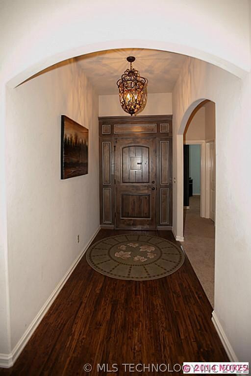 Welcoming entry with beautiful door and distressed