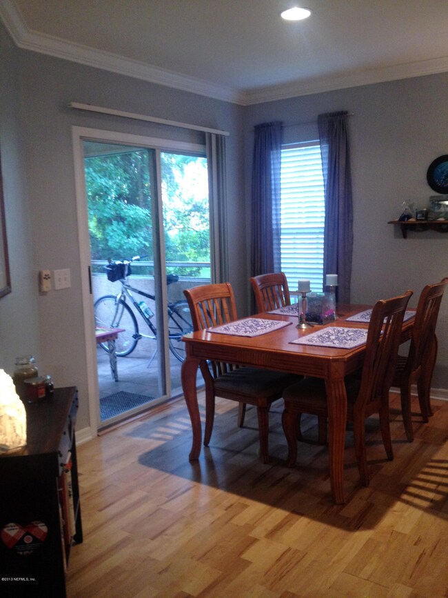 Living room view of dining and woods