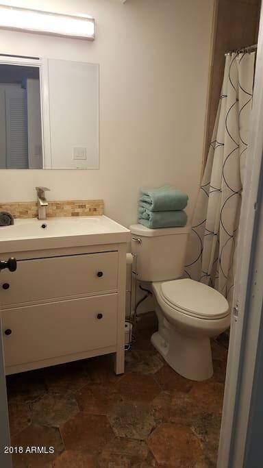 Upstairs bathroom with natural stone flo