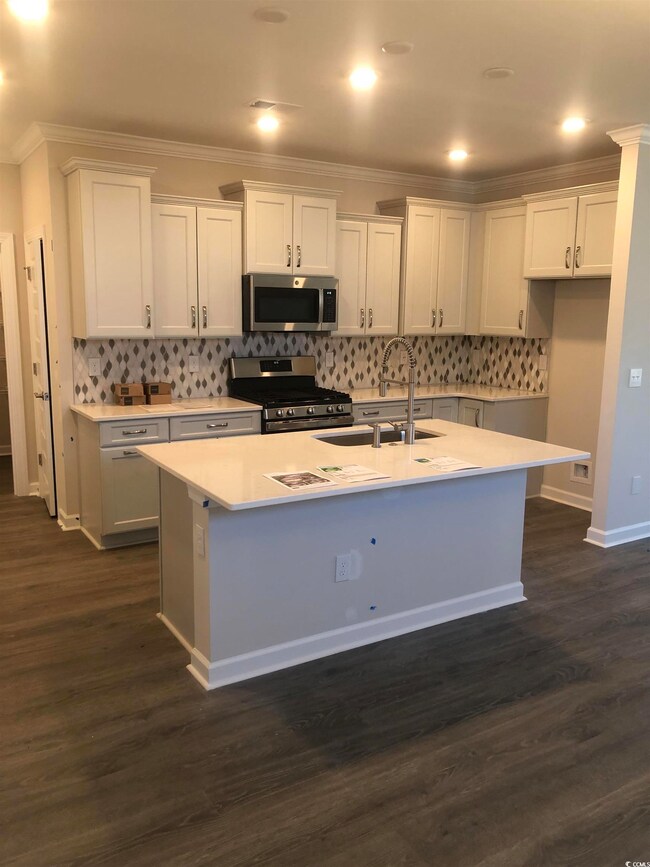 Kitchen with sink, appliances with stainless steel