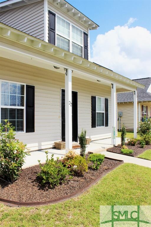 Inviting front porch adds to the charm of this hom