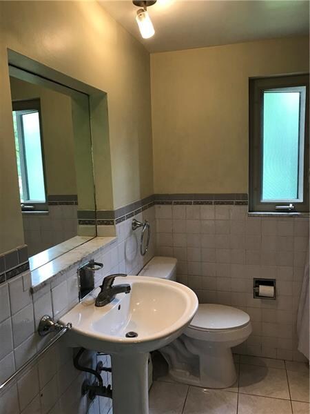 First floor full bath with newer toilet and recess