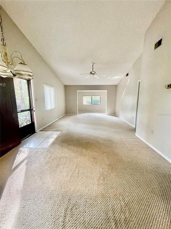 Living room, dining area and front door