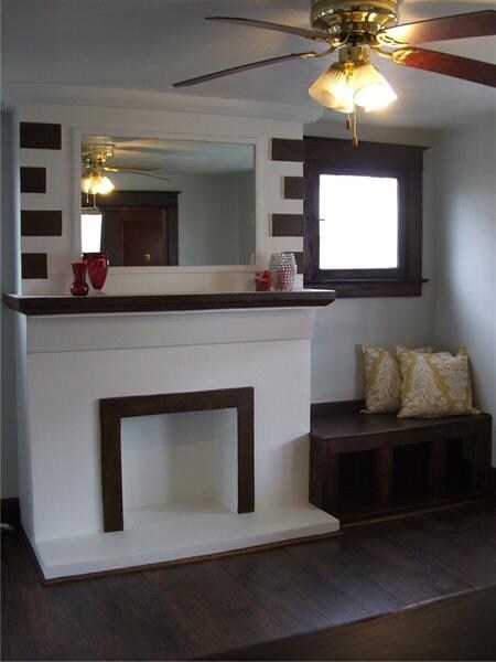 Gorgeous, decorative fireplace, flanked by built-i