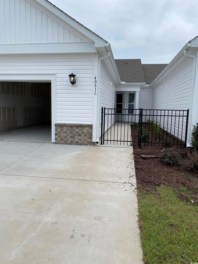View of side of home featuring a garage