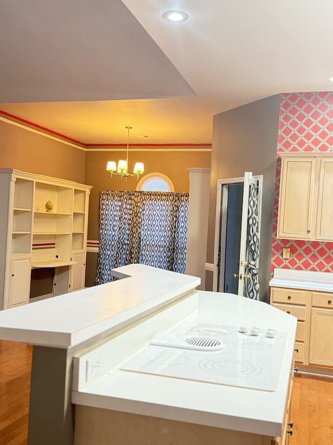 Kitchen featuring light wood-style flooring, reces