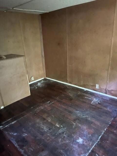 Empty room featuring wood finished floors