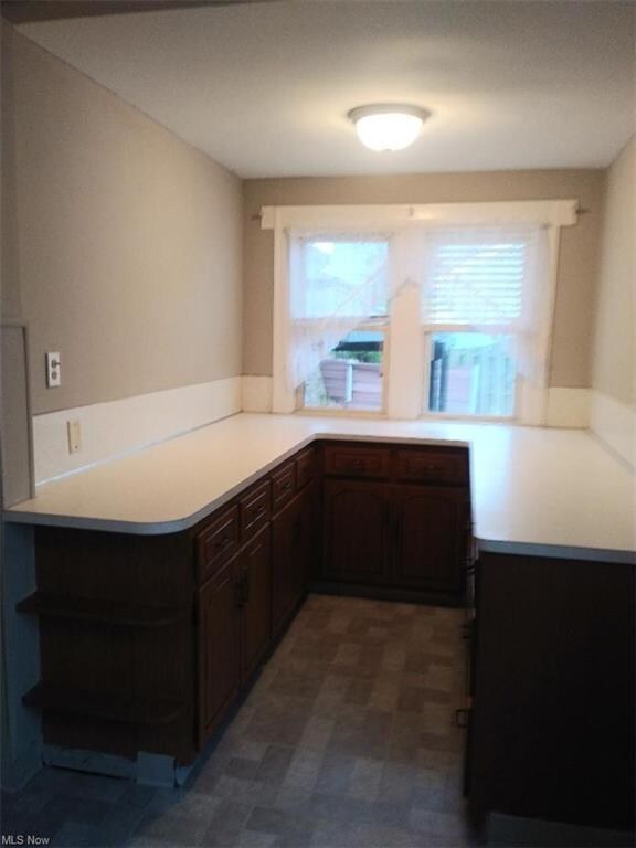 Extra cupboards and loads of workspace for the cook in the family.  Great space for that coffee maker, microwave, etc.