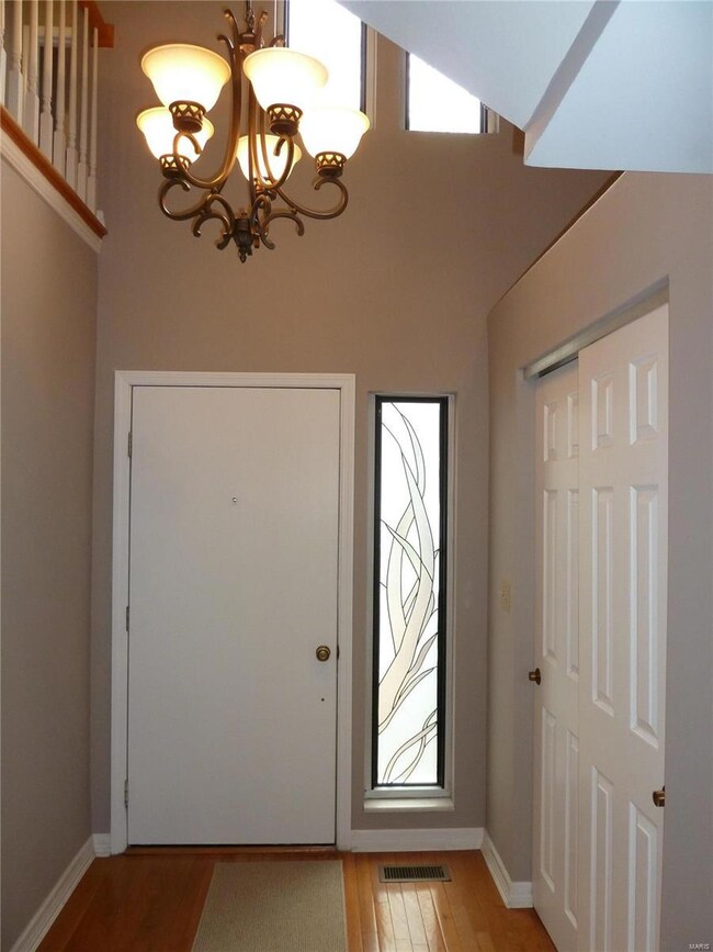 View of the front door, lovely side panel and larg