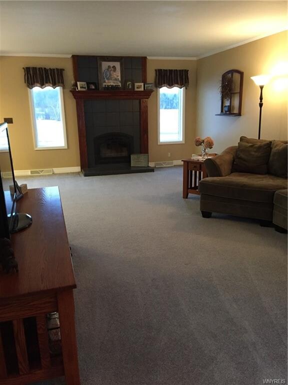 Living room with wood burning fireplace