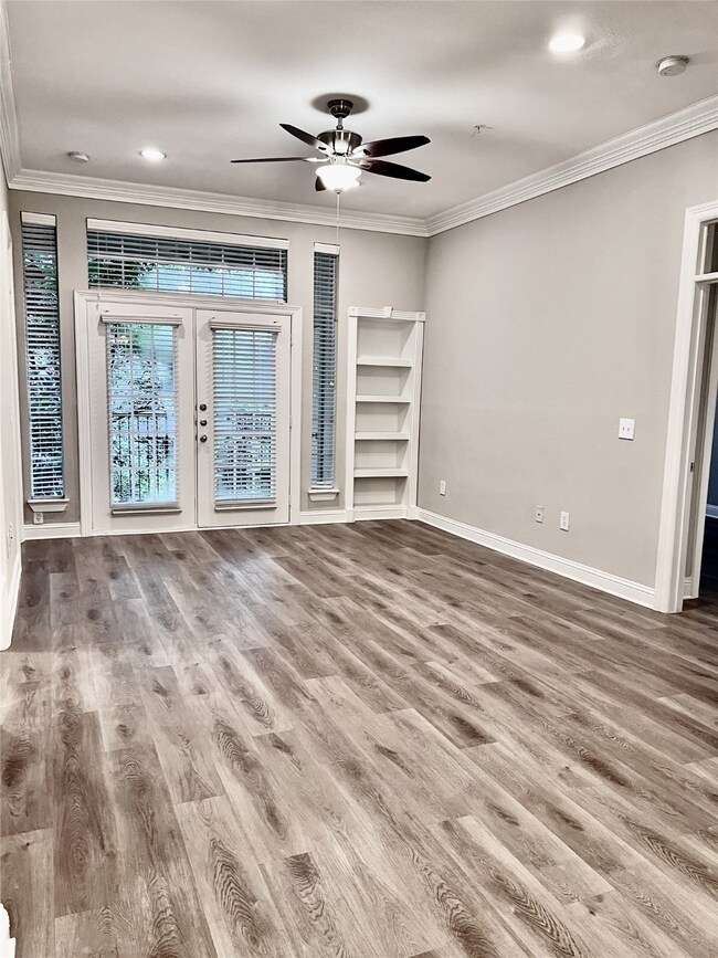Built-in bookshelf, crown molding & 10 foot ceilings.