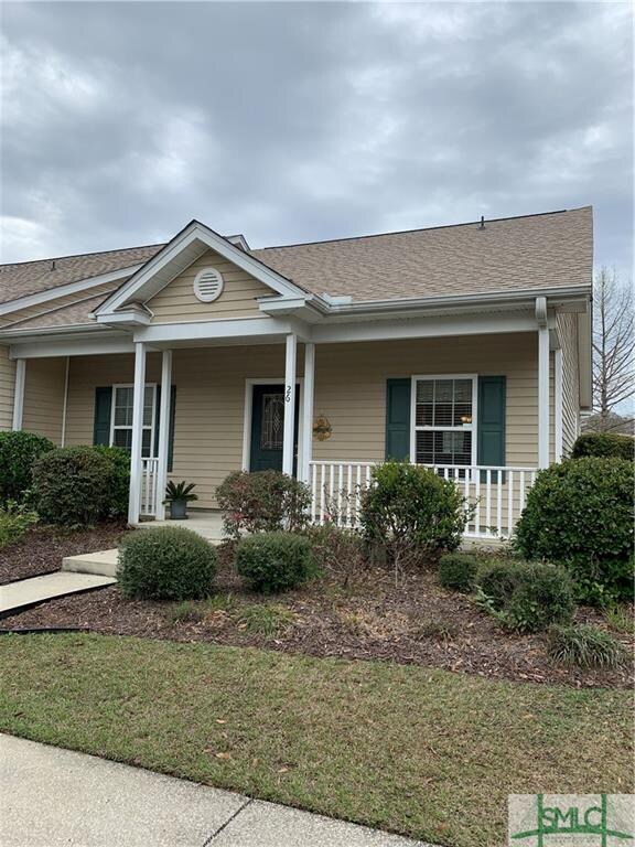 Full of southern charm, this covered front porch j