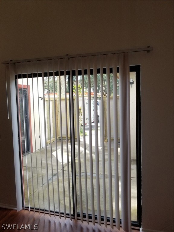 Sliders in living room, looking into courtyard