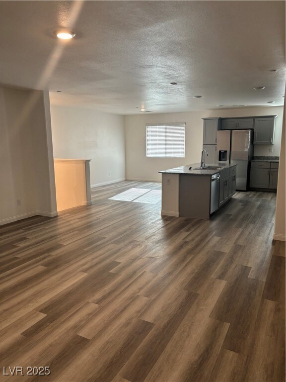 Kitchen with refrigerator, dishwasher, a sink, ope
