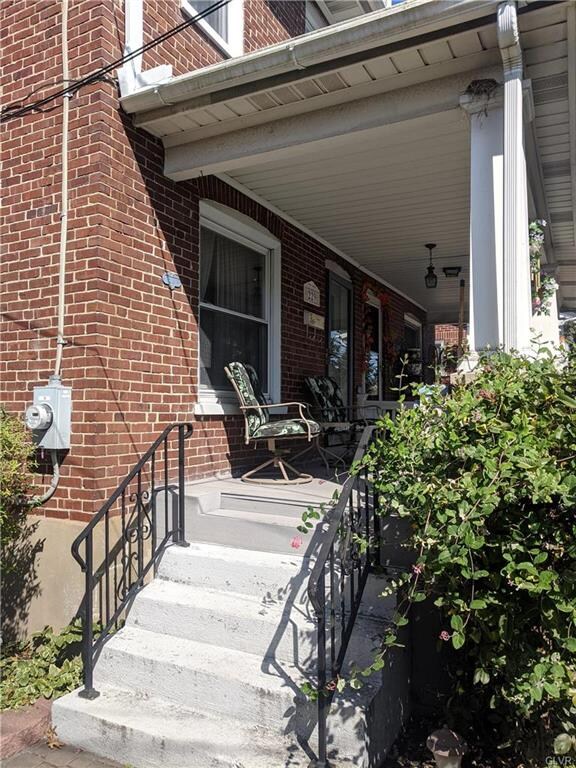 Covered front porch is low-maintenance composite d