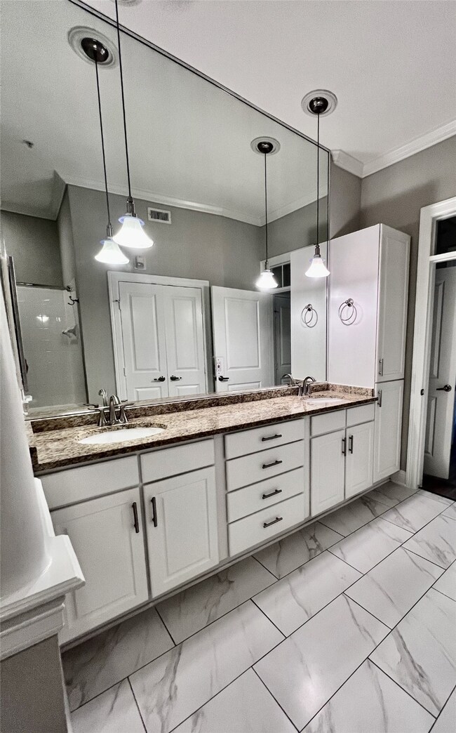 Double vanity sinks with over-sized garden tub in primarry bathroom.
