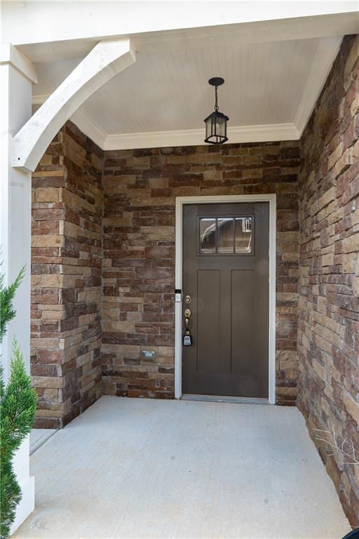 Entrance to property with brick siding