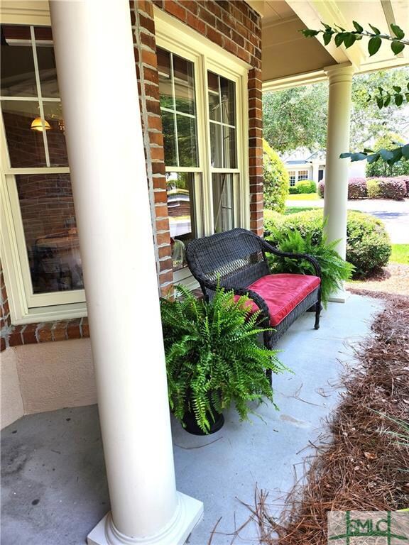The shady front porch gives you a broad view of th
