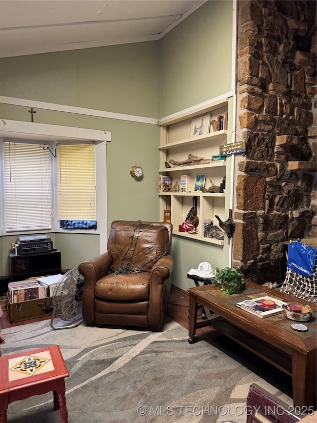 Living area featuring wood finished floors and hig