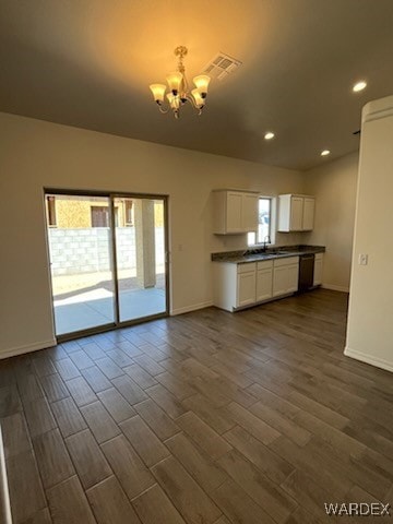 Unfurnished living room with dark hardwood / wood-