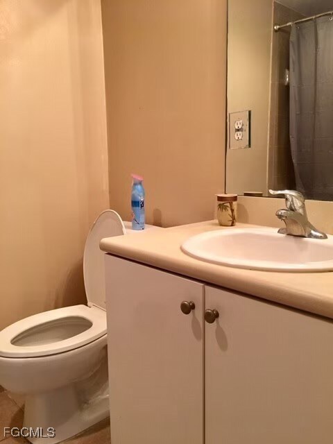 Bathroom with vanity and a shower with shower curtain