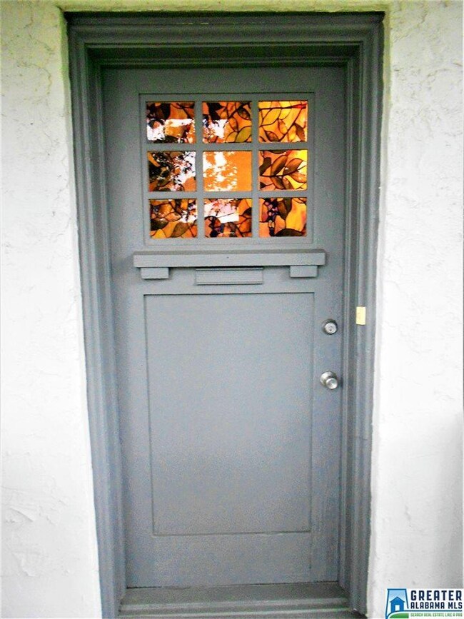 Beautiful stained glass door adds to the charm of 