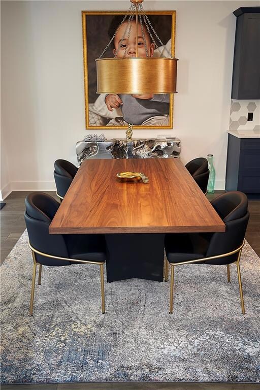 Dining area featuring dark hardwood / wood-style f