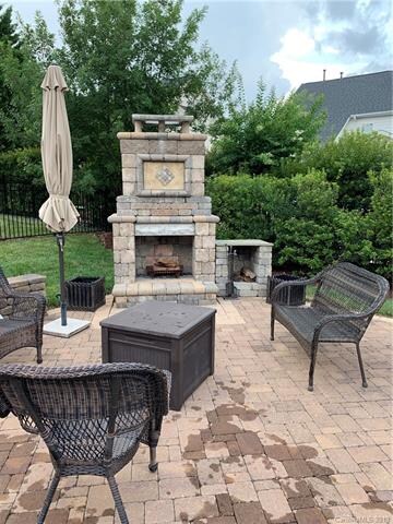 outdoor fireplace with brick paver patio