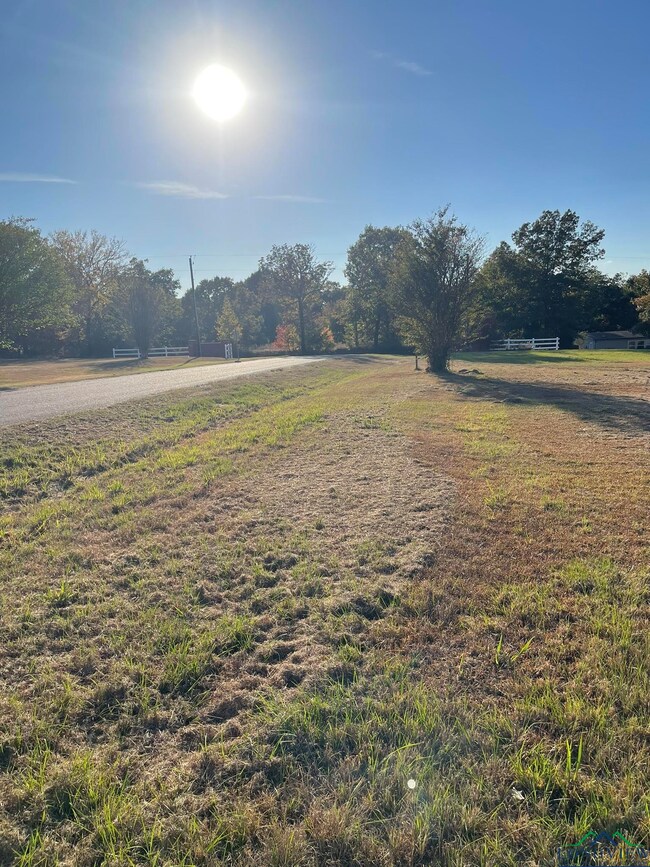 View of yard with a rural view