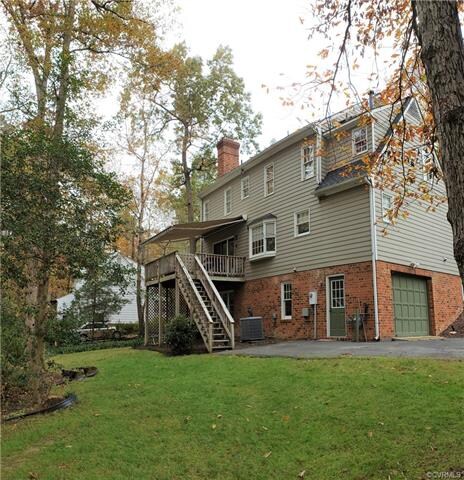 Beautiful low maintenance backyard with a large rear deck and retractable awning perfect for entertaining guests.
