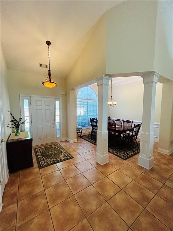 Foyer entrance featuring visible vents, light tile