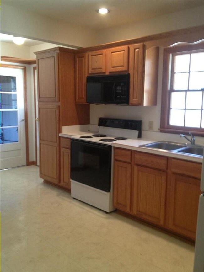 Remodeled Kitchen with newer oak cabinetry.