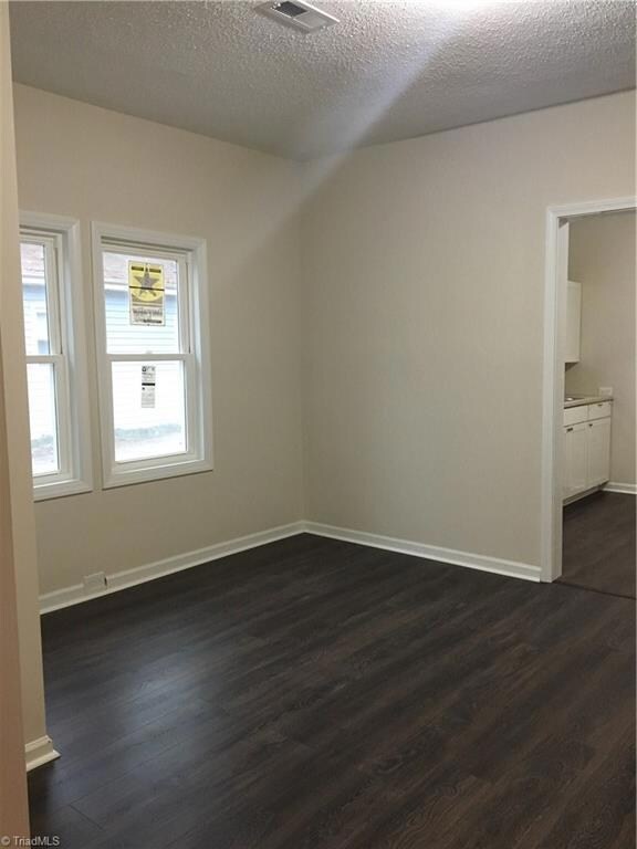 Dining room with new flooring, paint, and windows
