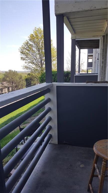 Enjoy balcony overlooking Lawrence skyline.  Faces