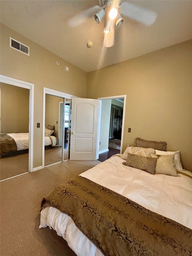 Bedroom featuring carpet and ceiling fan