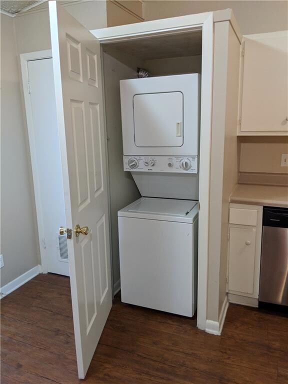 Laundry room featuring estacked washer and dryer,