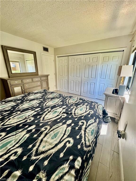 Bathroom with tile floors and a pantry cabinet for added storage