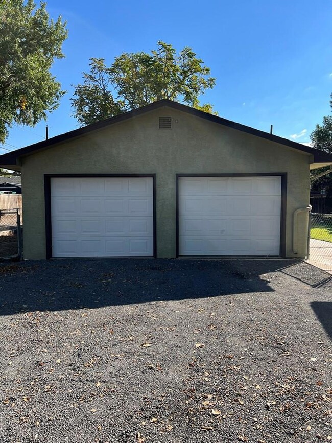 Large 2 car garage RV parking next to it