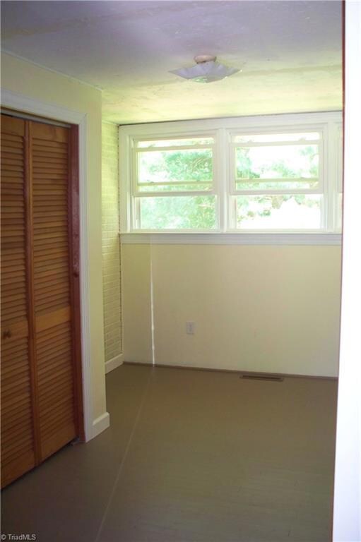 Third bedroom with lots of built in shelving