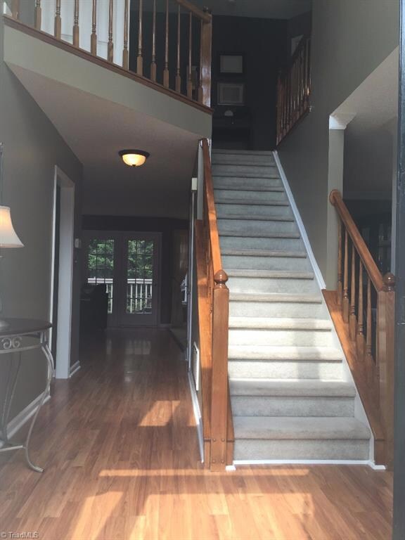View coming into foyer, landing and balcony overhead.