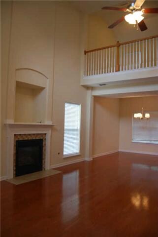 View from foyer looking into formal dining and view of loft above